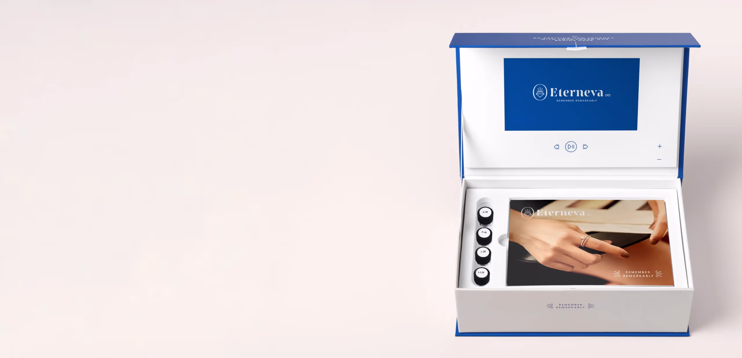 An open Eterneva box holding four small vials, beside a screen showing hands cradling a diamond.