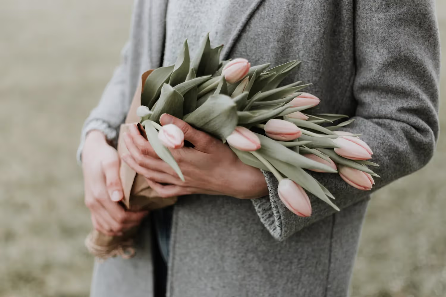 Person holding flowers.