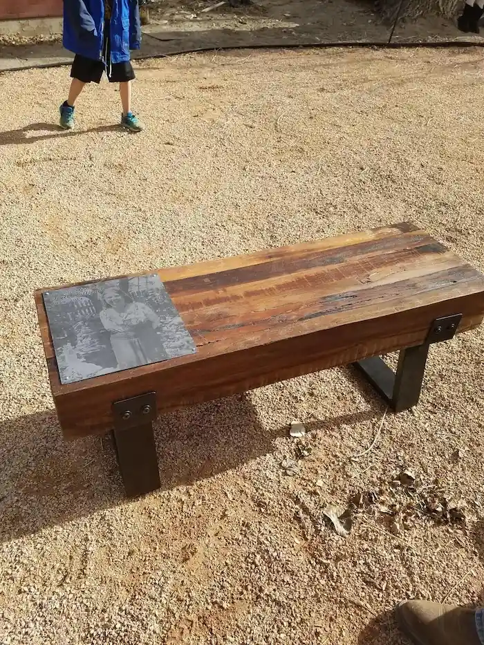 Memorial bench with Joyce's picture engraved in it.