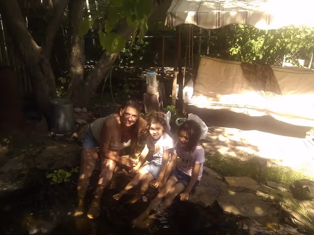 Pat's family hanging out at the koi pond.