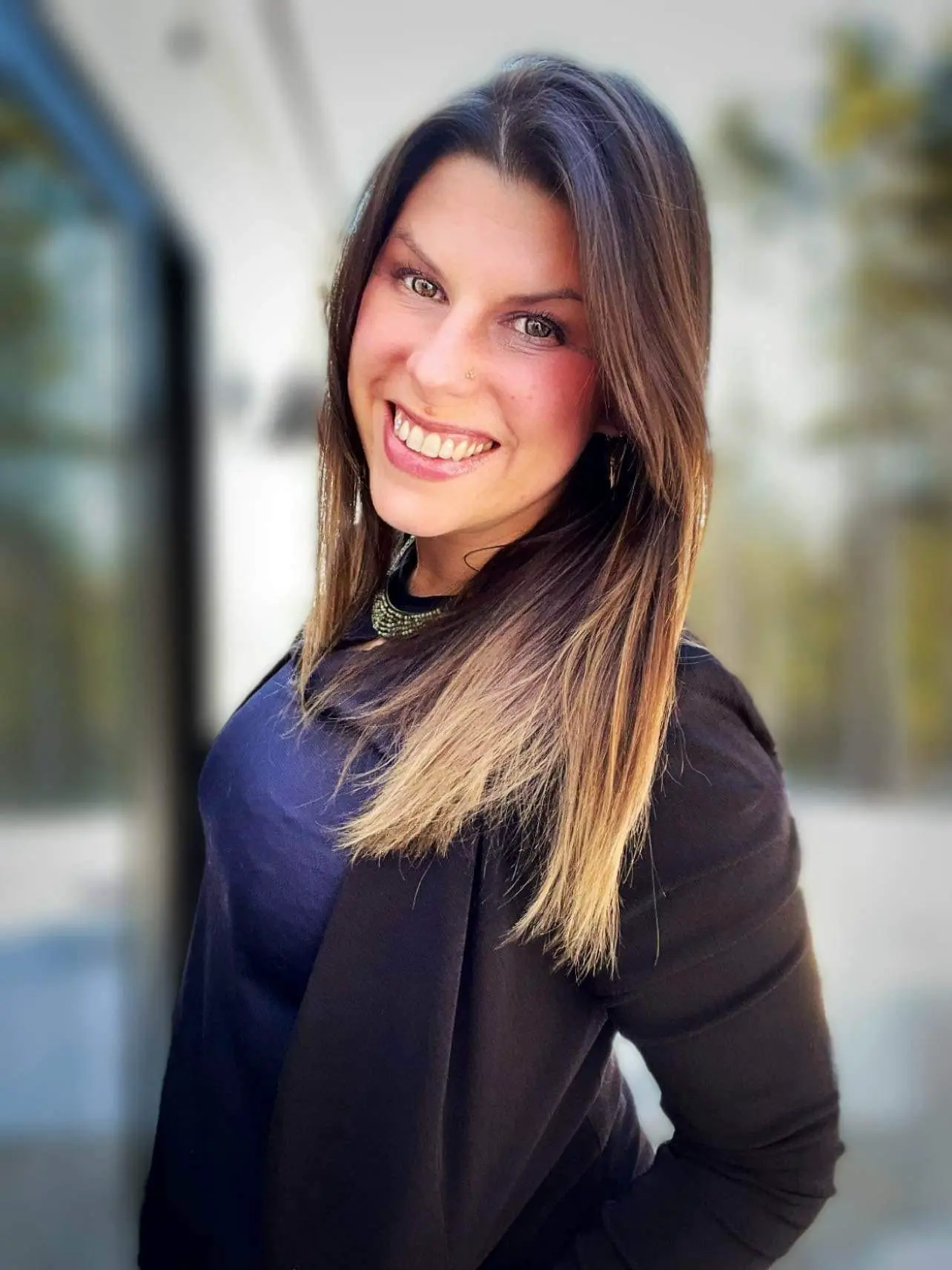 Smiling portrait of Lizzie Baker.